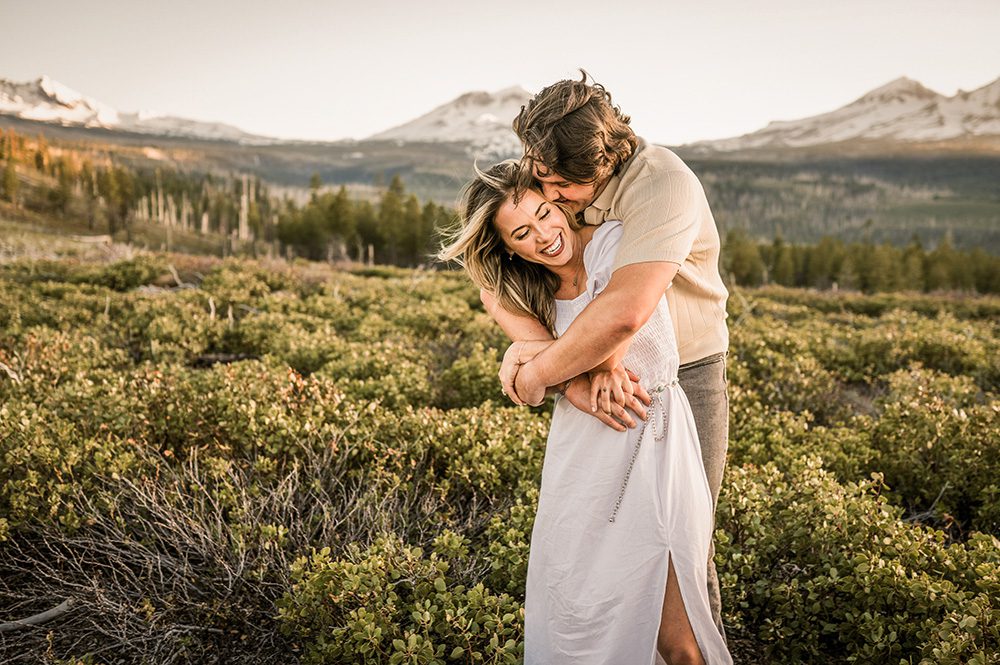Engagement photos in the mountains near Bend Oregon with Sisters Mountains